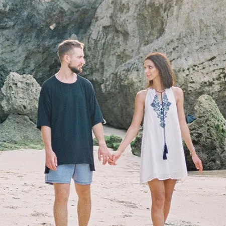 Travel couple Rachel and Chris from Canada reviewing personalized honeymoon itinerary by Bali Assist Co