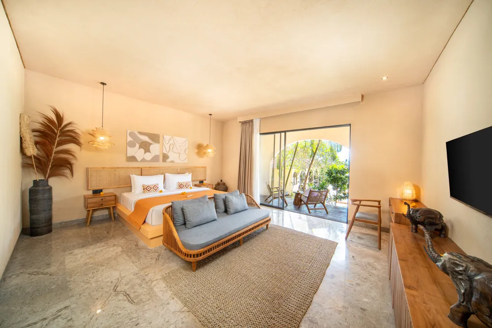 Spacious luxury villa suite with warm lighting and private garden terrace in Bali selected by Bali Assist Co