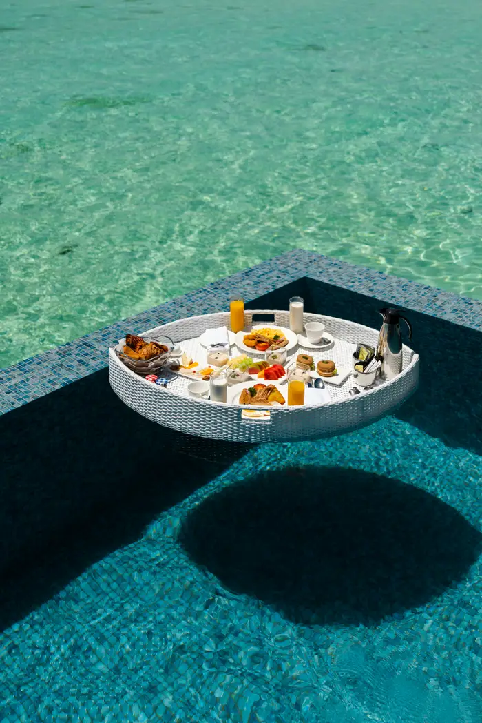 Luxury floating breakfast tray floating on a private villa swimming pool in Bali curated by Bali Assist Co