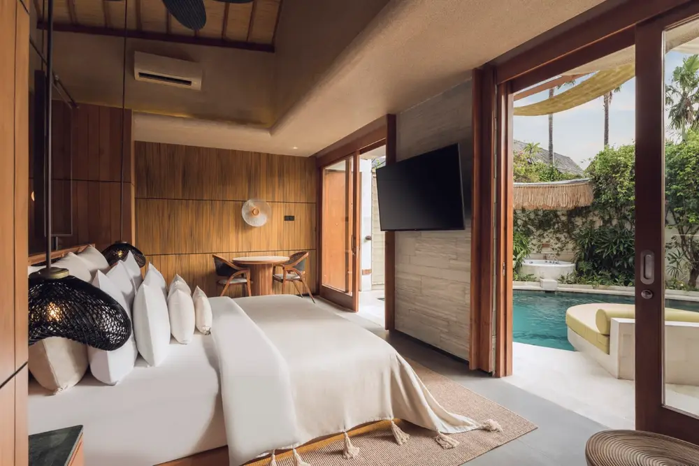 Sunlit modern wooden villa suite with direct private pool access in Bali selected by Bali Assist Co