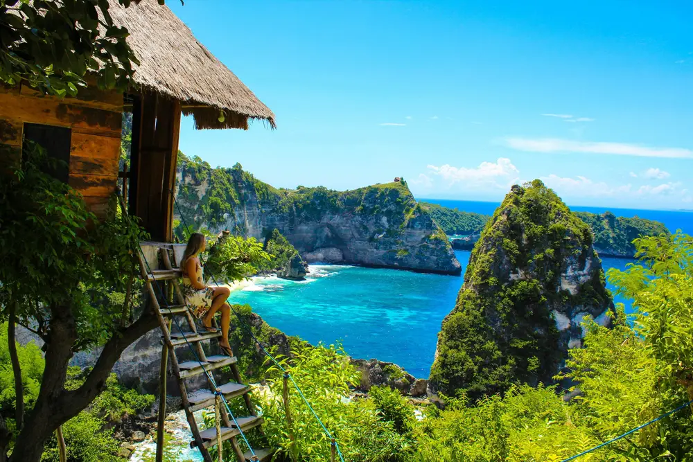 Scenic view of Diamond Beach cliffs and turquoise water in Nusa Penida Bali organized by Bali Assist Co luxury tour