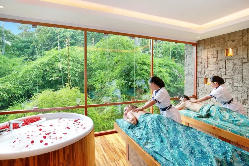 Couple enjoying a relaxing spa treatment with jungle view in Ubud for The Discovery Day 2 by Bali Assist Co
