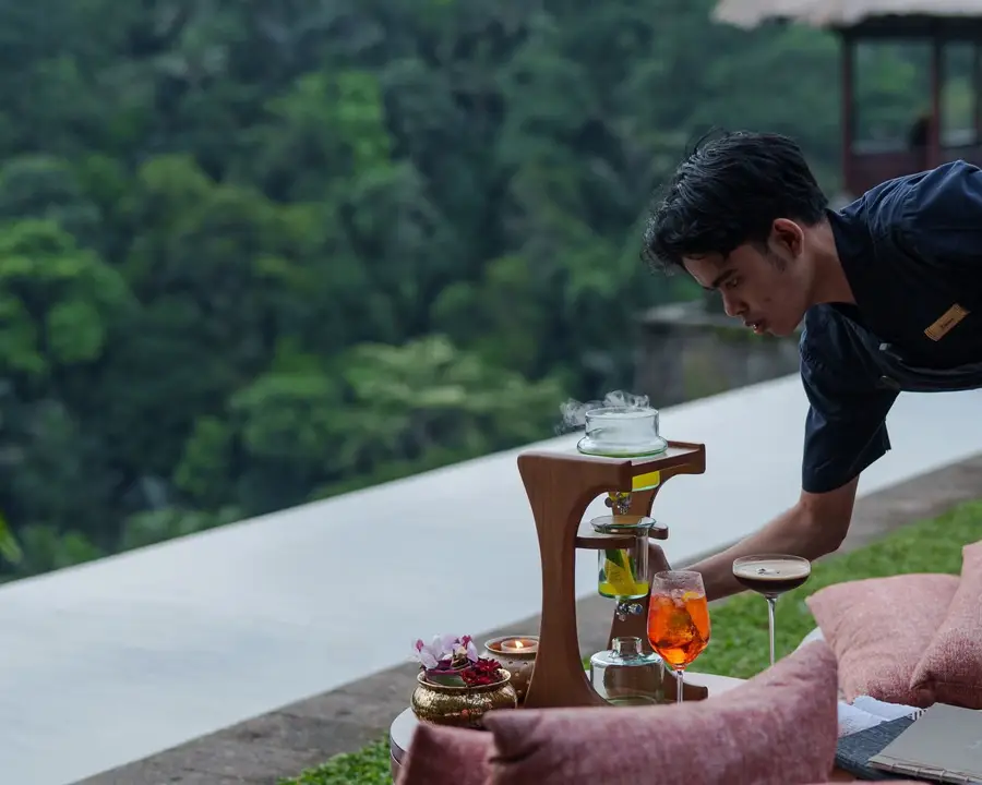 Crafted sunset cocktails and aromatherapy setup overlooking Ubud forest at Ambar Ubud by Bali Assist Co