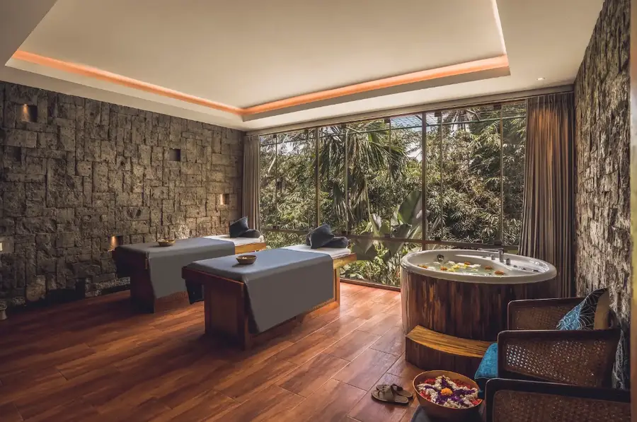 Luxury couple spa treatment room with wooden bathtub and nature view in Seminyak for The Grand Escape Day 2 by Bali Assist Co