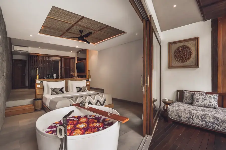 Luxury villa bathtub decorated with colorful flower petals in Ubud for The Grand Escape stay by Bali Assist Co