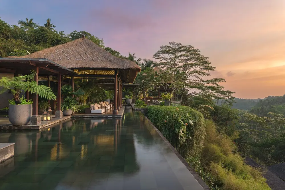 Scenic sunset view over Mandapa jungle valley from Ambar Ubud cocktail bar for The Indulgence Day 5 by Bali Assist Co