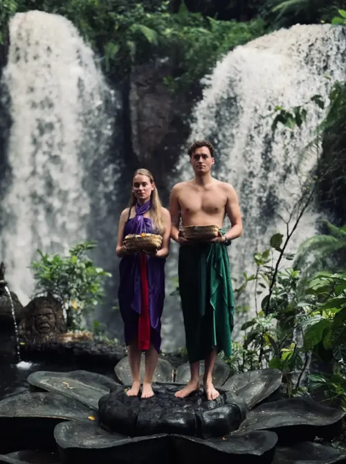 Couple standing near Beji Waterfall wearing traditional Balinese sarongs for The Journey Day 5 by Bali Assist Co