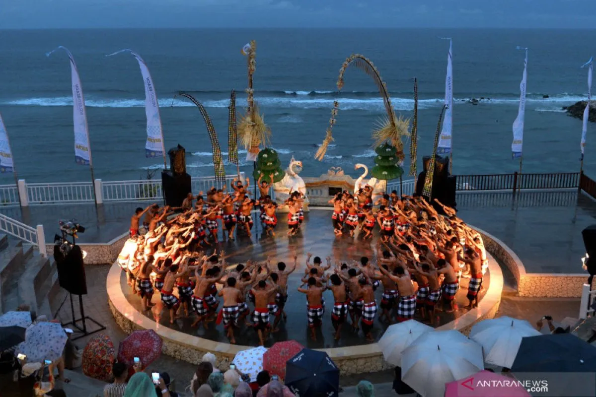 Traditional Kecak dance performance by the ocean amphitheater at Melasti Beach for The Journey package by Bali Assist Co