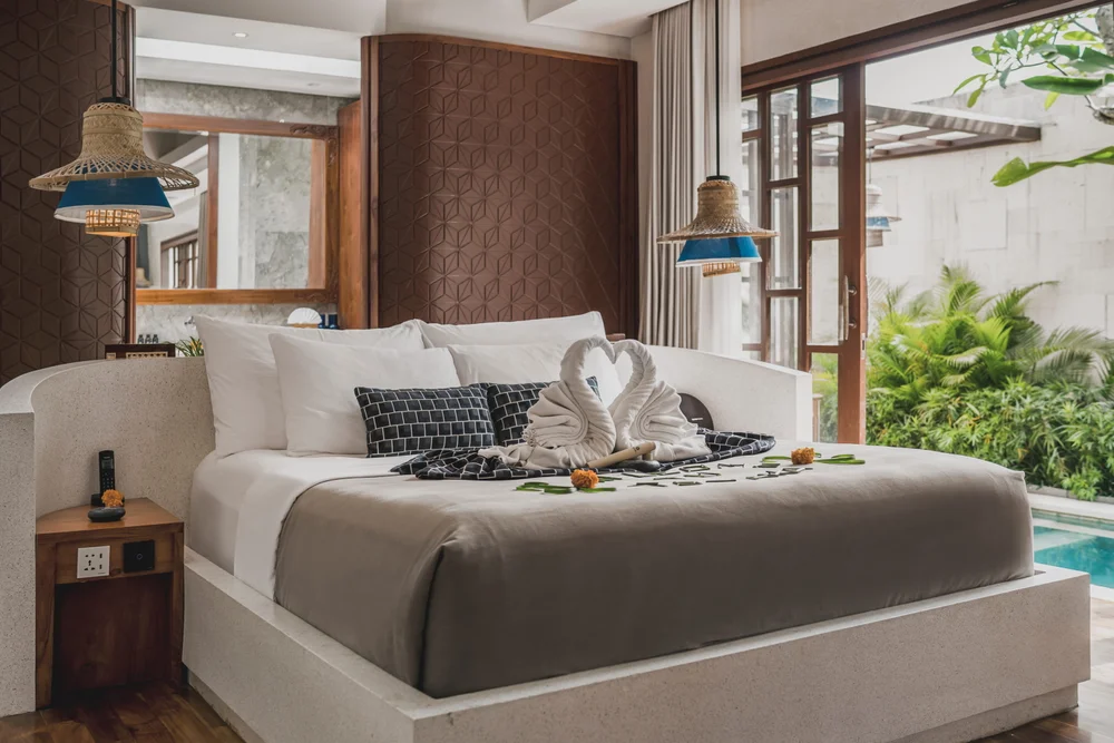 Luxury honeymoon suite bedroom with towel swans setup in Ubud for The Journey package Day 1 by Bali Assist Co