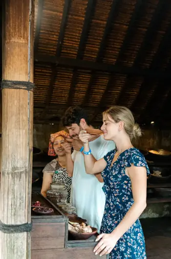 Couple enjoying traditional Luwak coffee tasting session at Alas Harum farm tour by Bali Assist Co