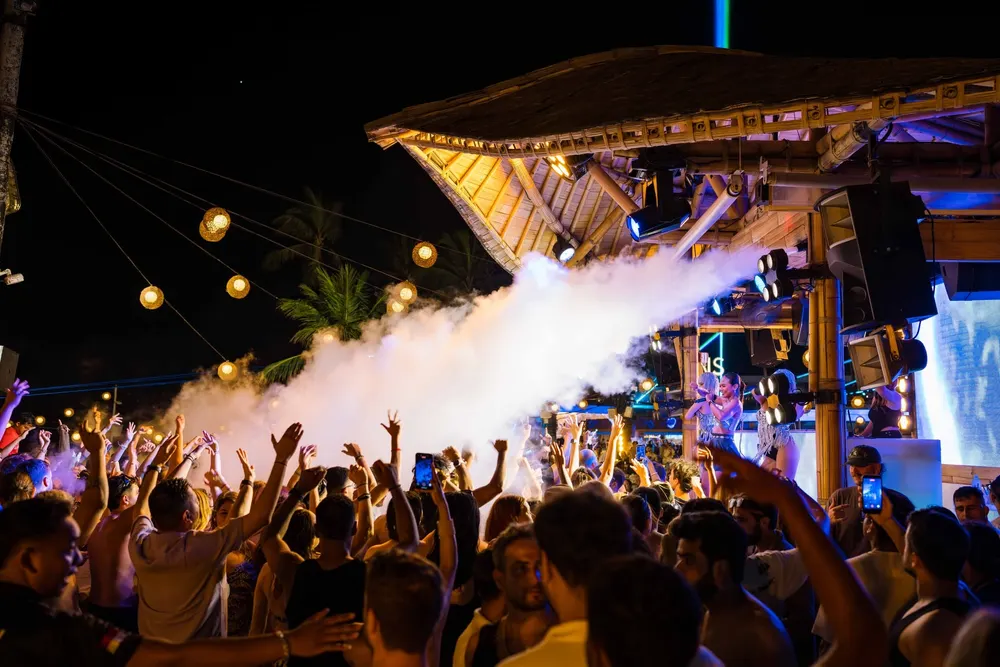 Vibrant night party experience with smoke effects at Finns Beach Club Canggu by Bali Assist Co