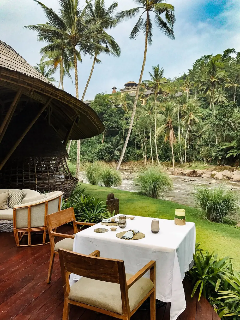 Fine dining table setup by Ayung River at Kubu at Mandapa Ubud by Bali Assist Co