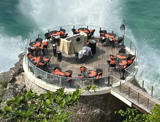 Open-air cliffside seating area at Rock Bar AYANA Bali for The Signature Journey Day 10 by Bali Assist Co