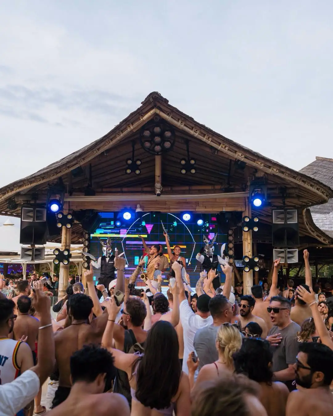 Crowd enjoying live DJ performance and party atmosphere at Finns Beach Club Canggu for The Ultimate Bali Journey Day 3 by Bali Assist Co