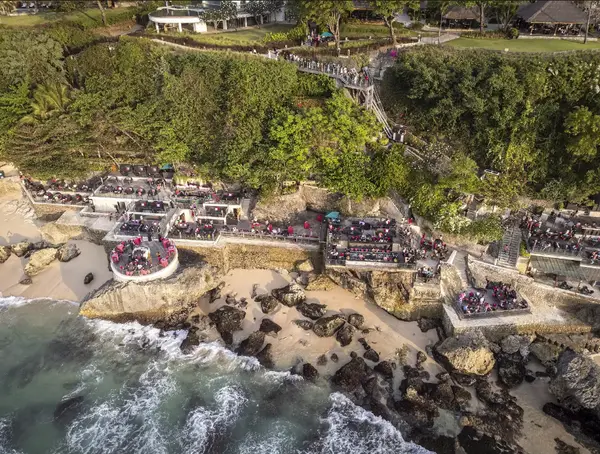 Aerial view of Rock Bar Ayana Resort built on coastal ocean rocks in Jimbaran Bali by Bali Assist Co